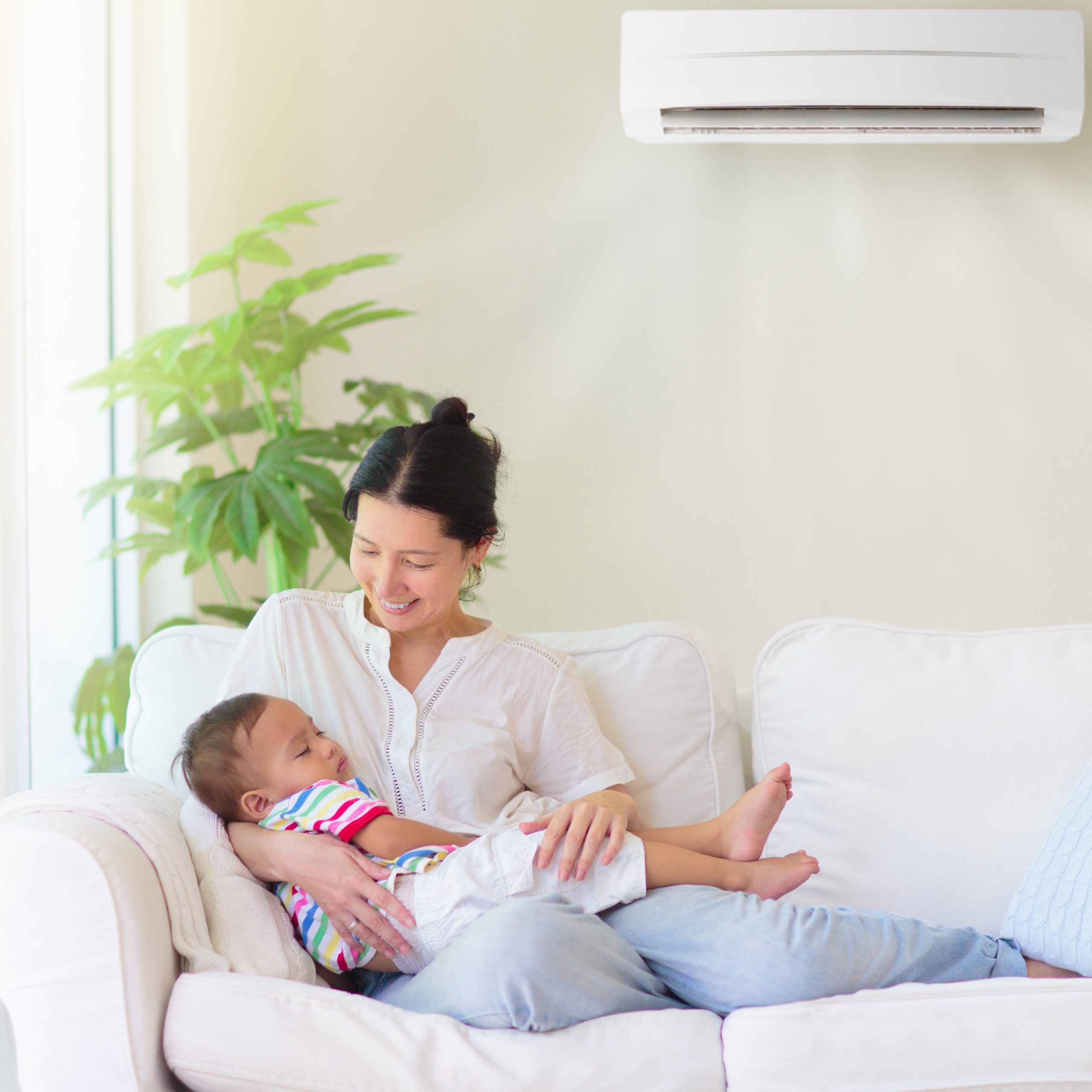 I & J Refrigeration Ltd | Mother and child with air conditioner remote Man Repairing Electric Heating Boiler by Taking Out a Water Heater at Home Bathroom Repairman fixing a broken electric boiler or furnace, Generative AI
