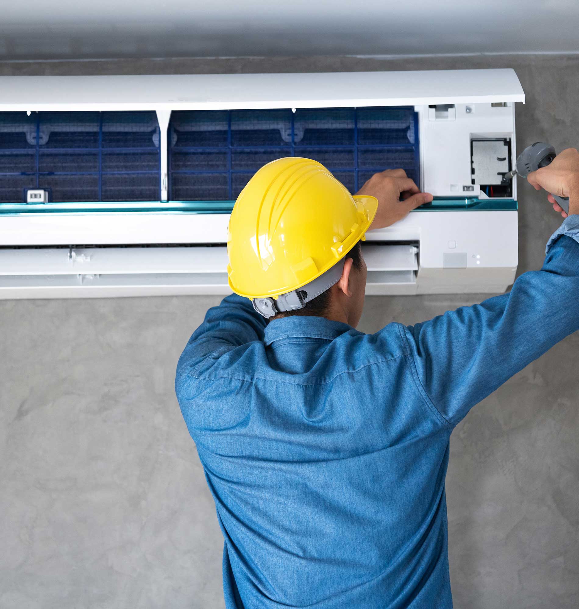 Technician man repairing ,cleaning and maintenance Air conditioner on the wall Technician man repairing ,cleaning and maintenance Air conditioner on the wall