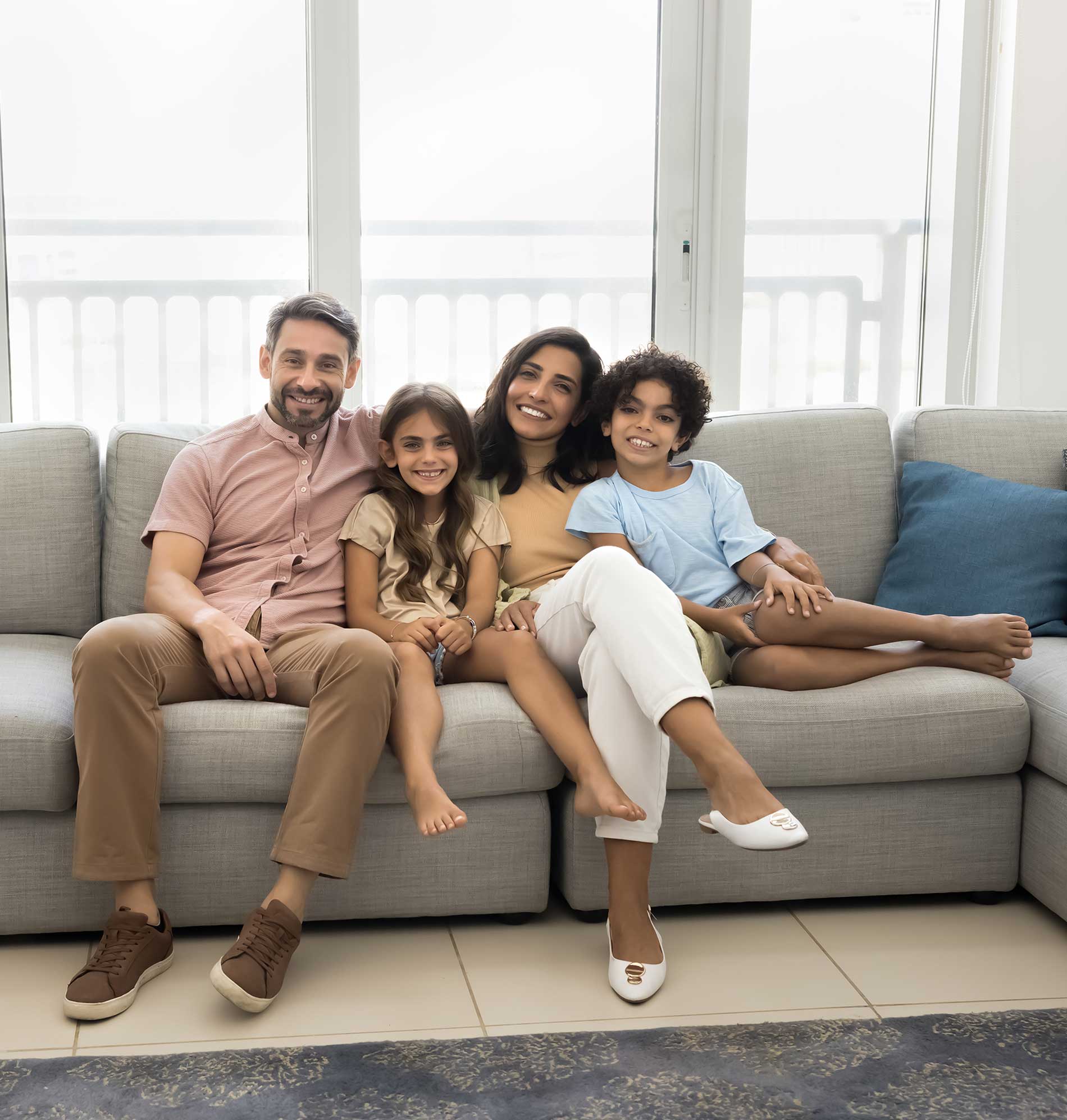 family laying together on a couch family laying together on a couch